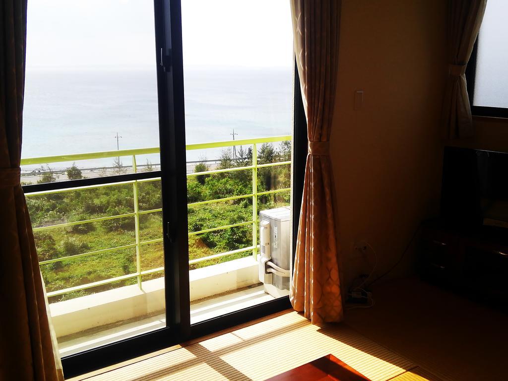 Kariyushi Condominium Ocean Hills Chouraku Stay Kin Exterior foto